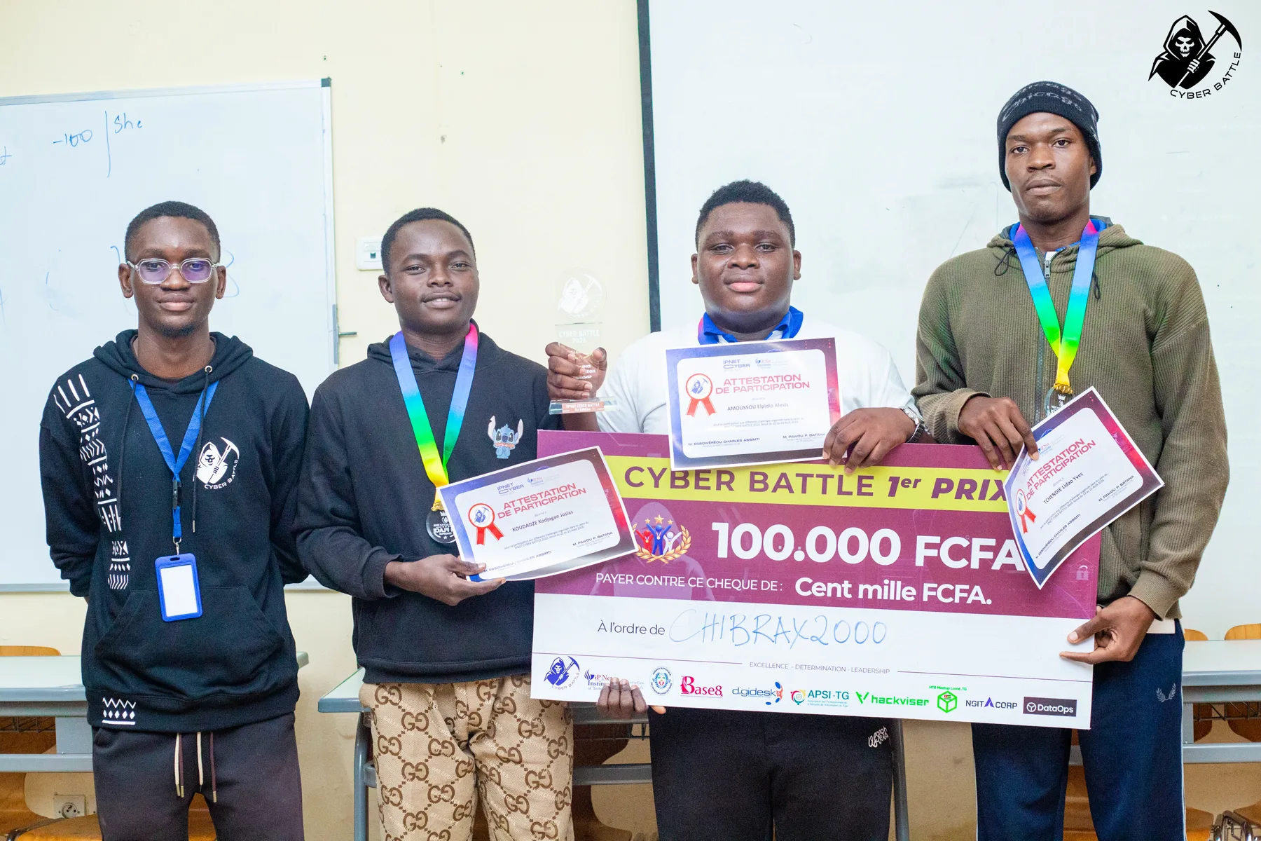Chibrax2000 receiving the first-place trophy and 100,000 FCFA prize
